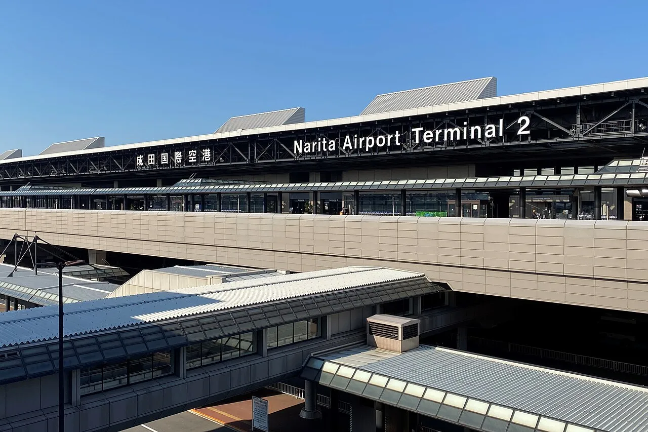 The curbside of Narita Airport Terminal 2 seen from a car park
