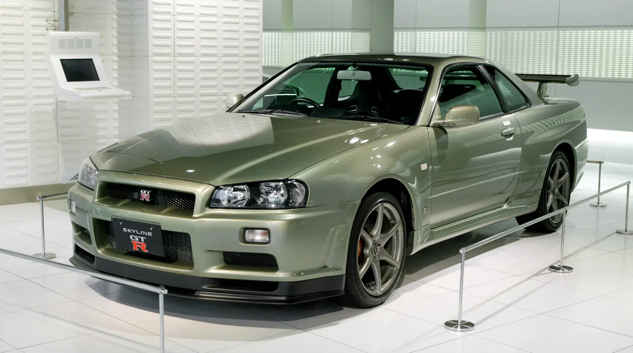 A green Nissan Skyline GT-R (R34) M-Spec Nür on display