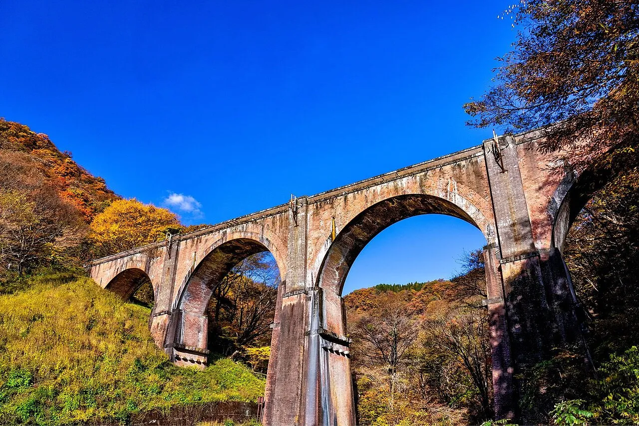 Usui Bridge No. 3 (Megane Bridge), a brick arch bridge surrounded by autumn leaves