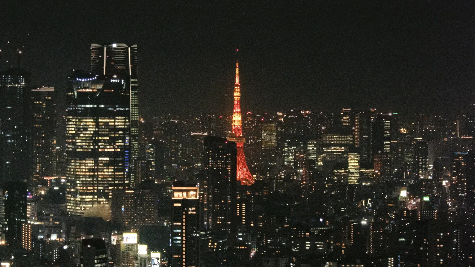 Tokyo's skyline at night with Tokyo Tower lit in orange
